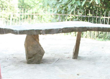Stone slab table in large barbecue area